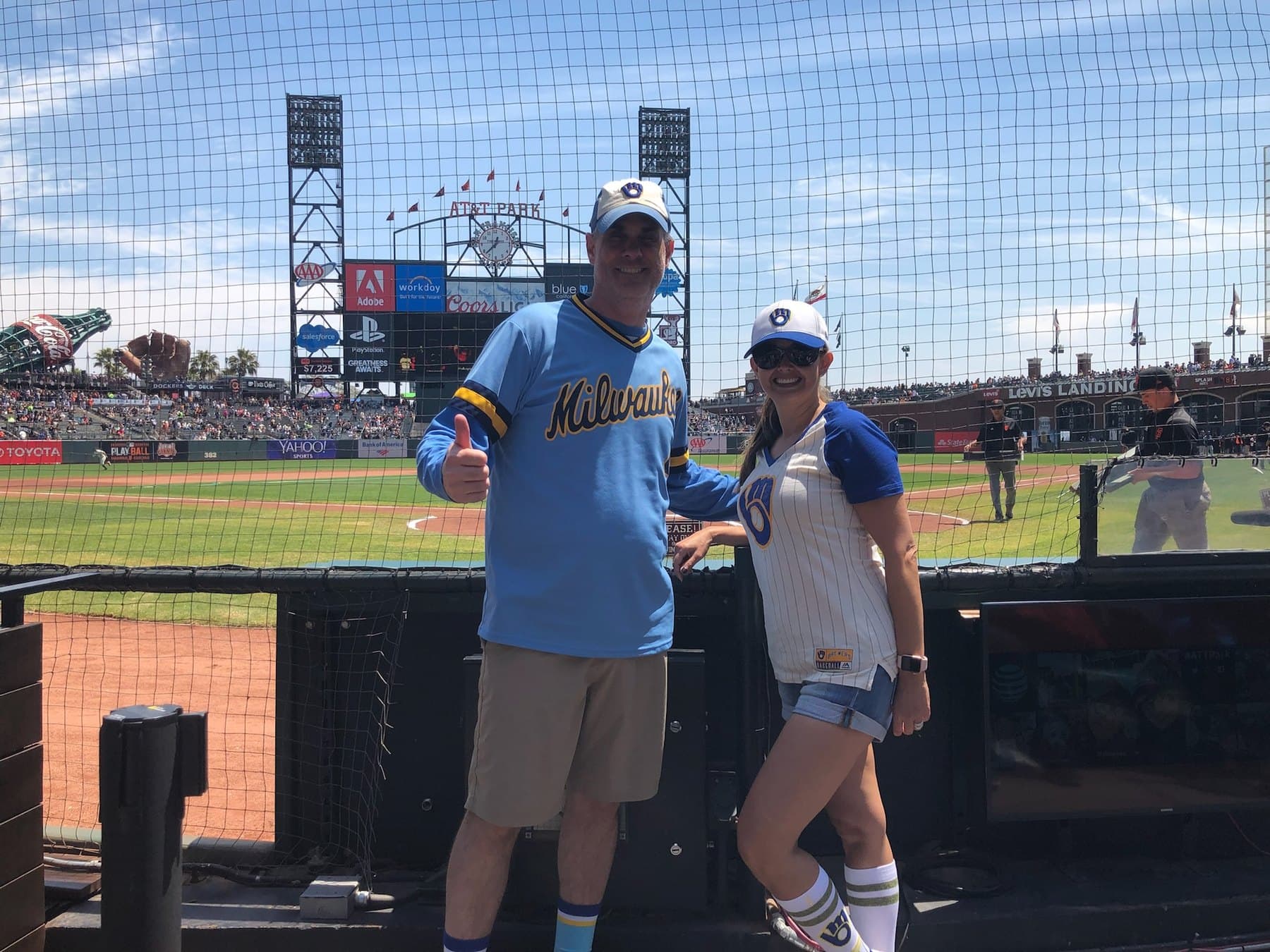 Cris and Shirley in Milwaukee baseball jerseys at the ballpark