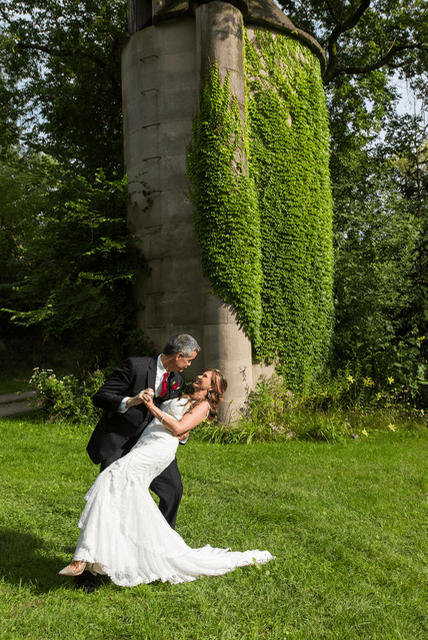 Cris dipping and kissing Shirley after their wedding