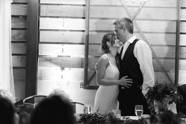 Cris kissing Shirley during the wedding reception