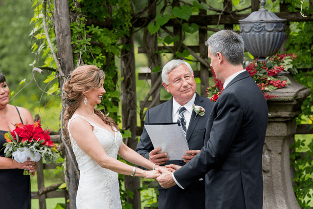 Uncle Ed officiating while Shirley and Cris exchange vows